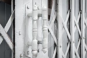 White steel door handles of the old sliding door