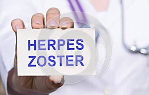 White sticker with text HERPES ZOSTER in doctor's hands with a stethoscope