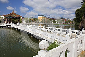 White stone bridge on lake