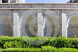 White stone carved cloisters and arches with arabic ornaments in the courtyard of Akhaltsikhe (Rabati) Castle, Georgia