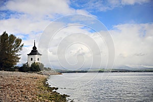 White stone chapel by Liptovska lake