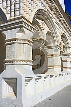 White stone columns with bas-reliefs