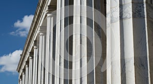 White Stone Columns Under a Blue Sky