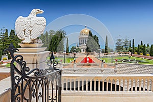 The white stone eagle guards the gate to Bahai Gardens in Haifa, Israel