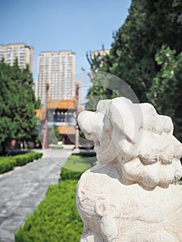 White stone lion guarding the entrance to the Confucius temple