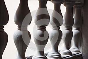 White stone railing. Detail of classical Pillars. weathered stone railing