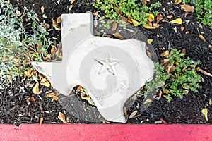 White stone shaped as state of Texas with a Lone Star symbol carved photo