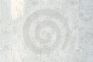 White stone square grid texture background.