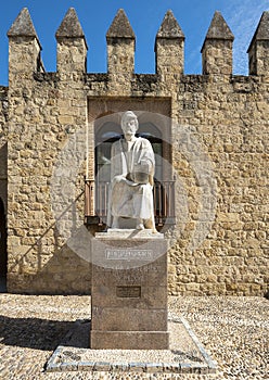 White stone statue of Averroes, 12th Century Islamic Scholar, by the city wall in Cordoba, Spain.