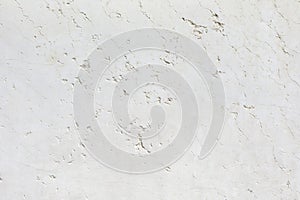 White stone texture background with cracks and signs