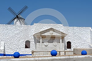 White stone wall with local symbolics in Campo de Criptana, Castilla la Mancha, Spain photo