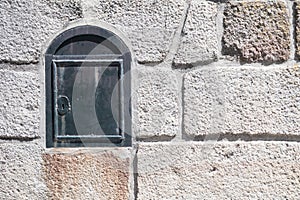 White stone wall with mail box