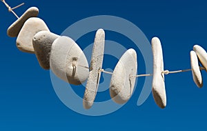 White stones on a blue clear sky