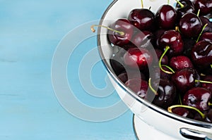 White strainer with cherries