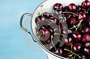 White strainer with cherries