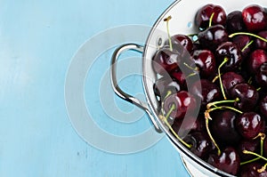 White strainer with cherries
