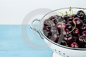 White strainer with cherries