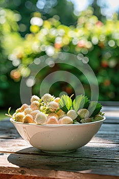 white strawberries in a white bowl on the table. Selective focus