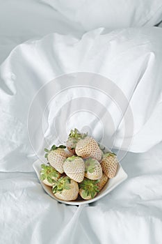white strawberries in a white bowl