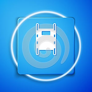 White Stretcher icon isolated on blue background. Patient hospital medical stretcher. Blue square button. Vector