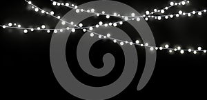 White string Christmas lights in black background for decoration and Abstract Holiday Background