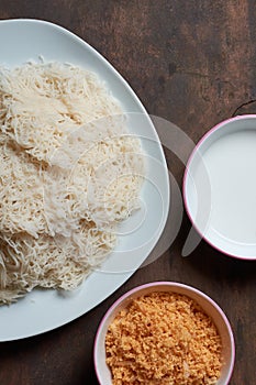 white string hoppers and coconut sambol top view