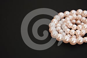 White String Pearls necklace, isolated on black Copy space