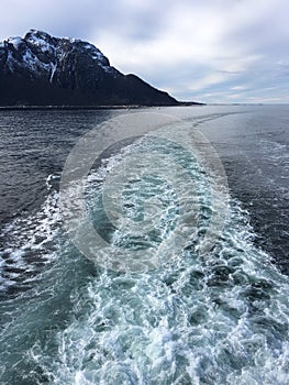 White strip after cruise ship in beautiful nature, Norway.