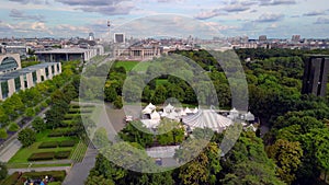 White striped circus tent in tiergarten. Tranquil aerial view flight Berlin