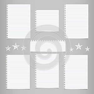 White striped note, notebook paper for message or text stuck on gray background with stars.