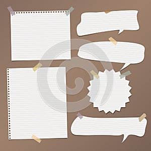 White striped speech bubbles, note, copybook, notebook paper with stuck on brown background.