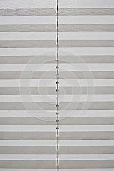 White striped textile blinder for window