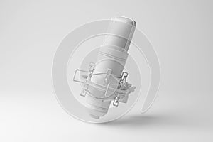 White studio condenser microphone floating in mid air in monochrome and minimalism