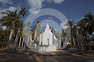 White stupa surrounded by pillars in Mihintale, Sri Lanka