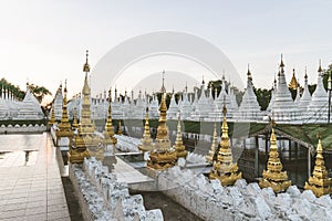 White stupas at Kuthodaw Pagoda in Mandalay, Myanmar photo