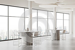 White stylish cafe interior with table and bar seats, eating space with window