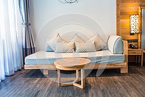 White stylish minimalist room with sofa. Parquet wood interior design