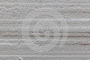 White styrofoam sheets in a stack, texture. Side view.