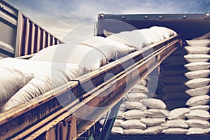 White sugar bags transferred to container for exporting photo