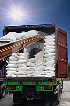 White sugar bags transferred to container for exporting