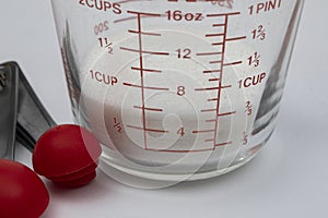 White Sugar in Measuring Cup