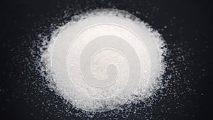 White sugar spilled from a bottle