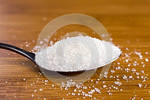 White sugar spoon bamboo table