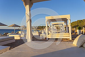 White sun canopy with mattress on luxury sand beach in tropical resort in Red Sea coast in Egypt, Africa