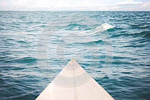 White surfboard on the sea, photo