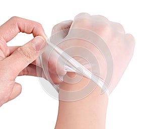 White surgical medical gloves isolated on white background with hands. Rubber glove manufacturing, human hand is wearing a latex g