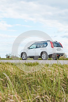 White suv car at roadside. road trip concept