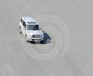 White SUV driving outside