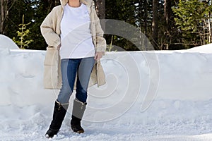 White sweatshirt mockup of a girl in quilted snow boots, model mockup