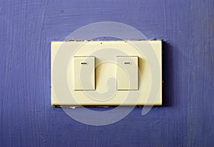 White switch on blue wall